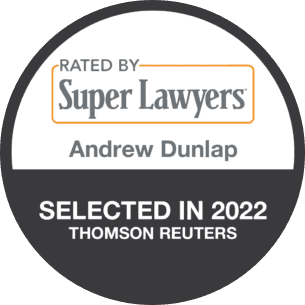 A badge that says rated by super lawyers andrew dunlap.