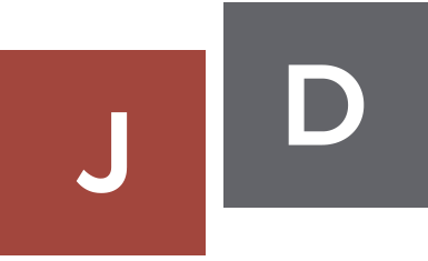 A red and white square with the letters u, d, and e.