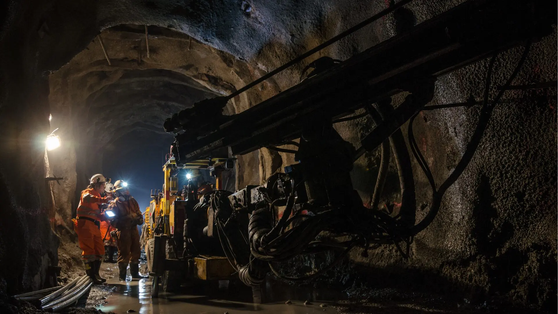 Mine workers ensuring accurate time tracking for fair compensation.