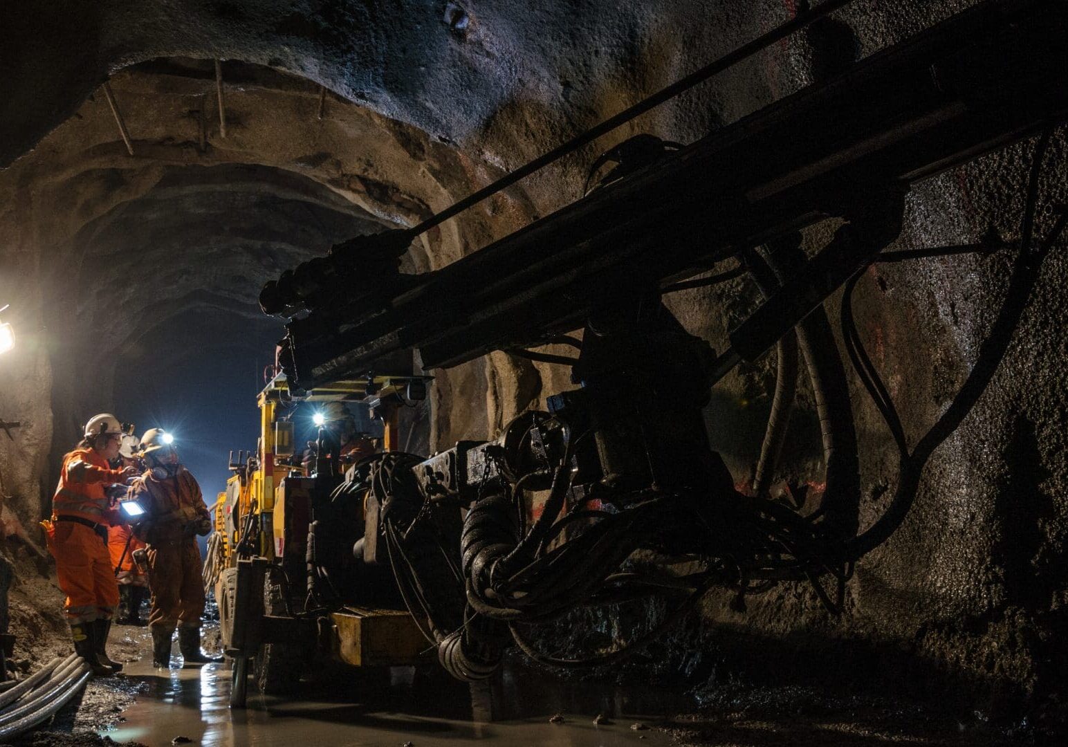 Mine workers ensuring accurate time tracking for fair compensation.